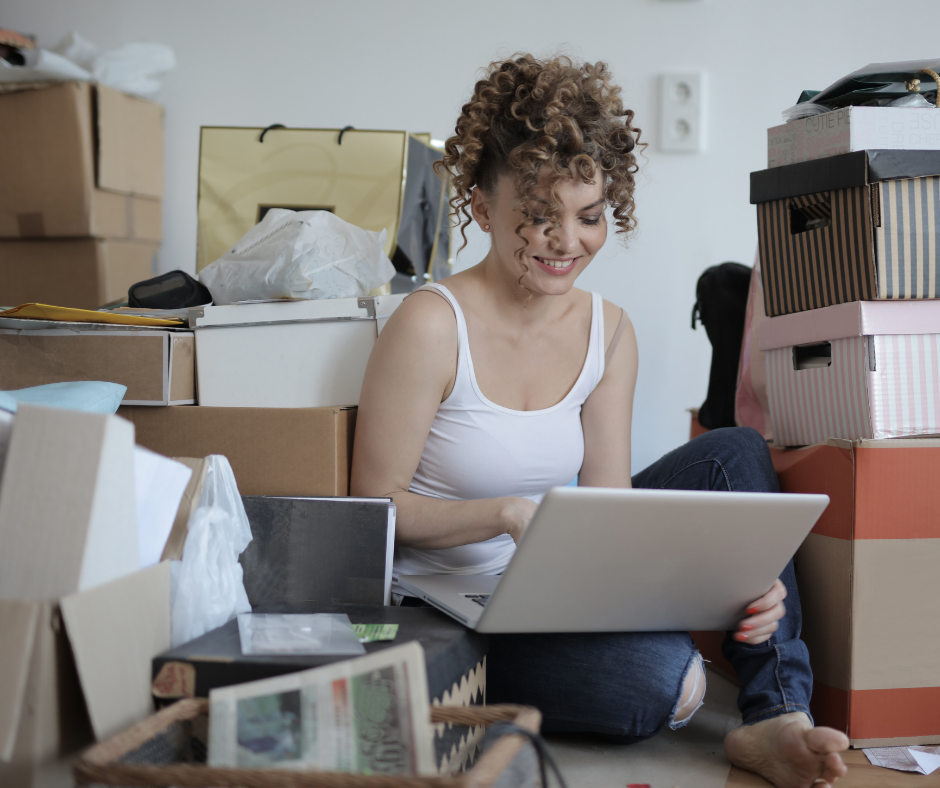 woman in the middle of a pile of junk trying to book 5 star
